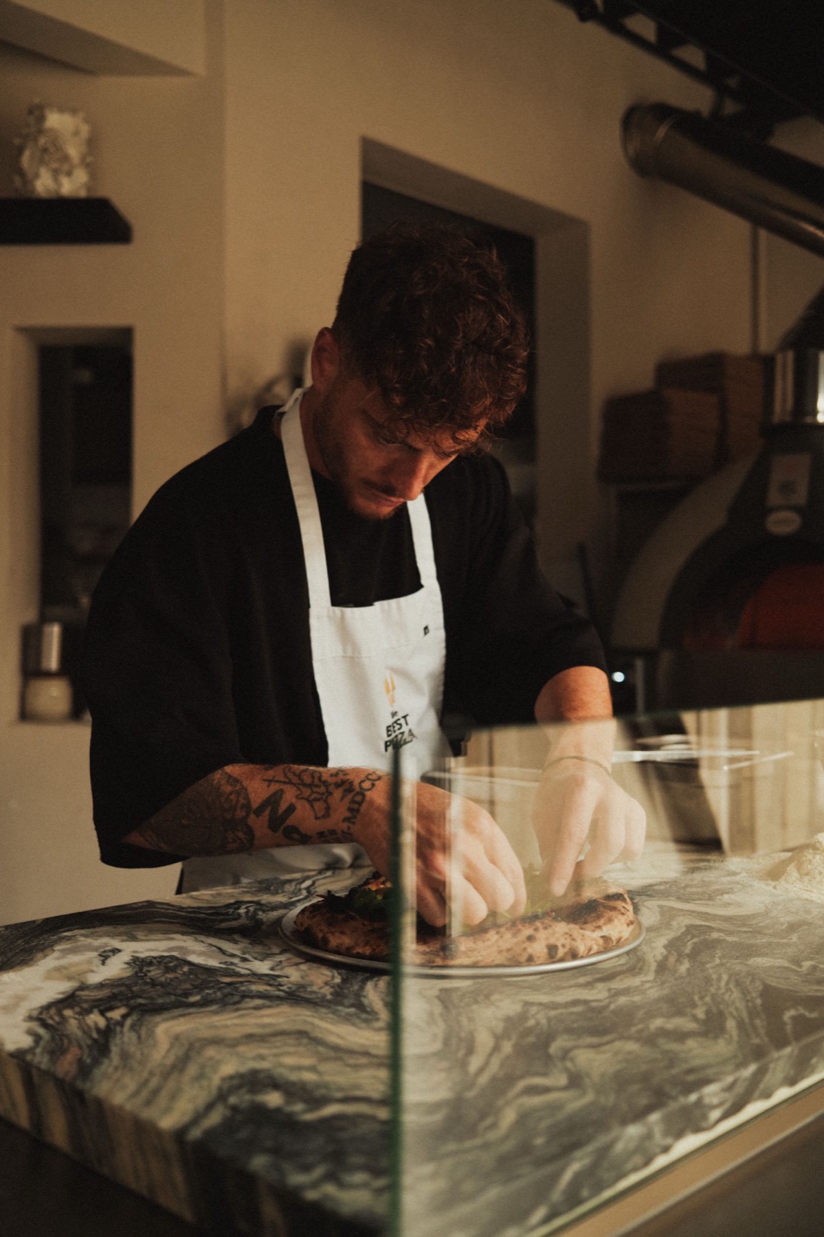 Pizzaiolo aan de toog